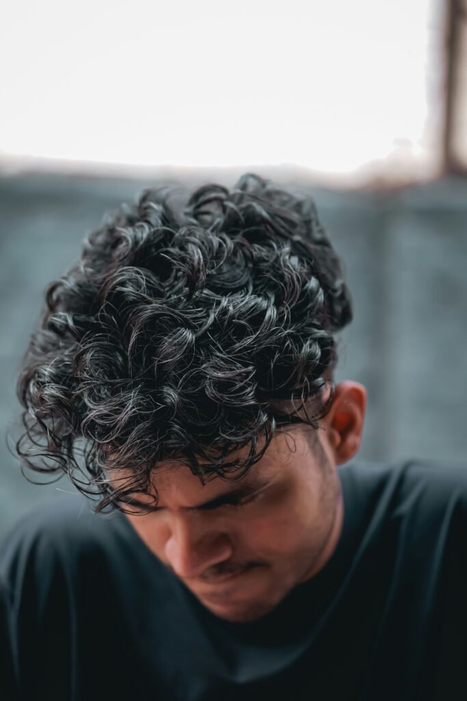 High Skin Fade with Curly Top